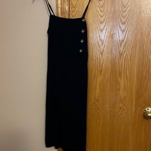 Black mid calf dress with accent button side,,slit on side wit pockets